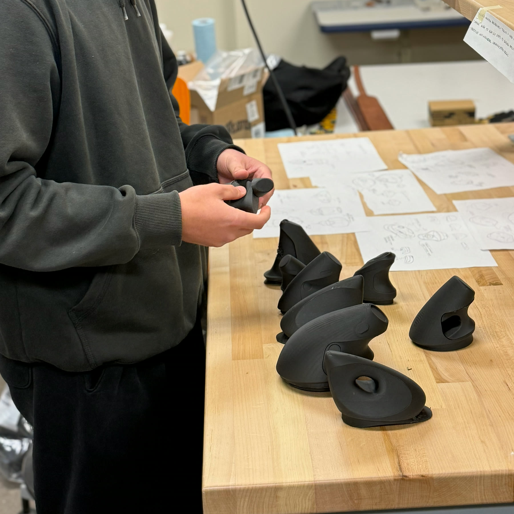 Participant holding an early Gentra prototype in-hand during user testing